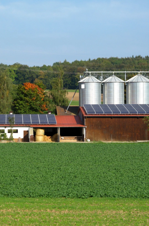 farm house and barn with solar panels